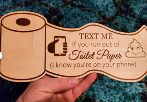 Laser cut toilet paper decor sign